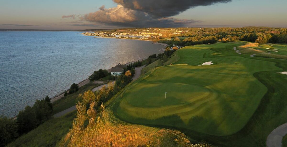 view of a hole at the Bay Harbor Golf Club with the majestic lake michigan on the left