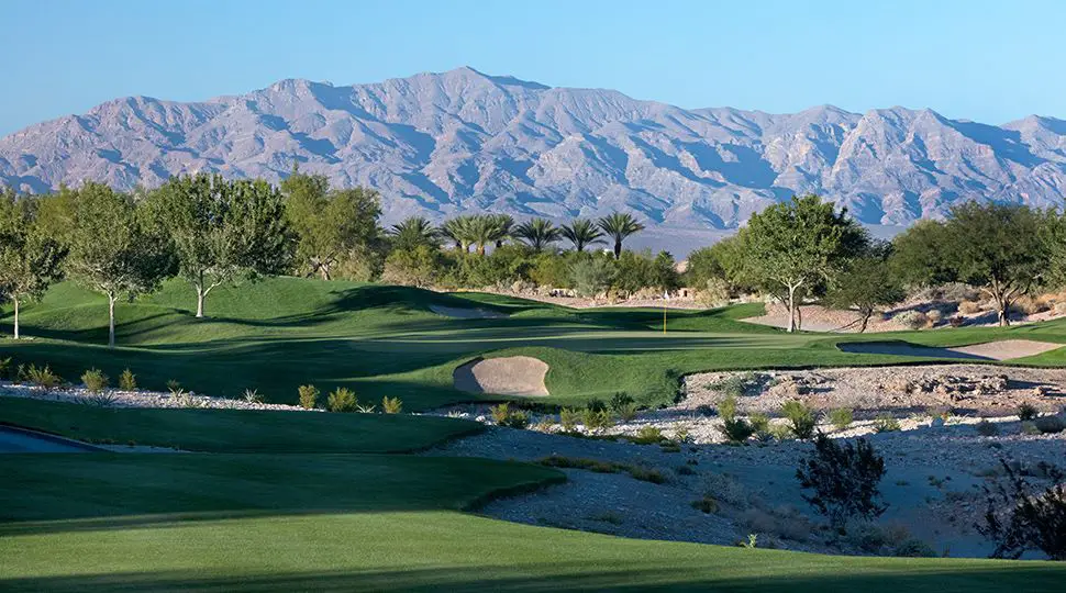 view of hole 16 at TPC Las Vegas with the mountains as the backdrop