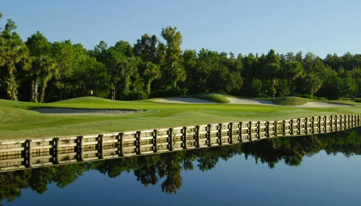 view of a hole at Westchase Golf Club with the lake in the foreground
