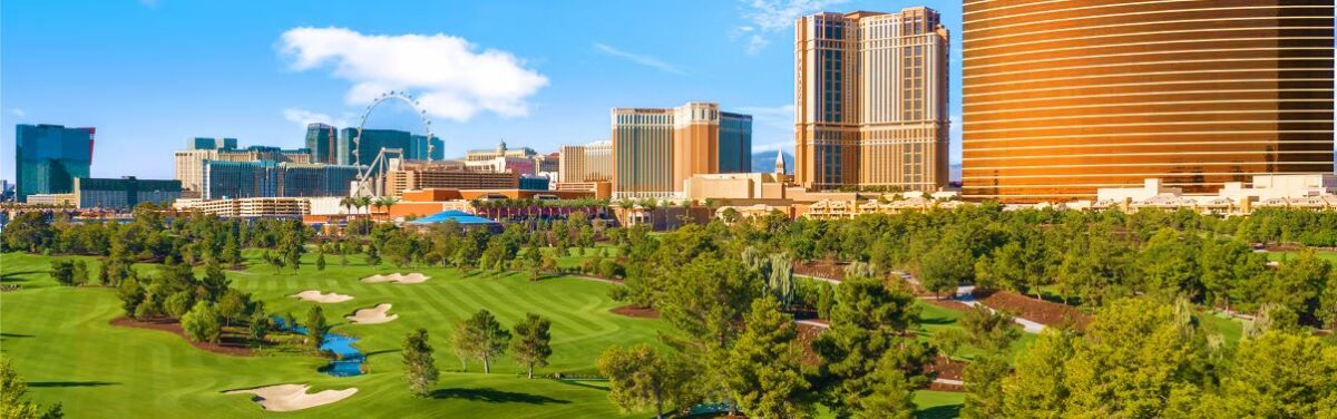 view of the golf course at Wynn Golf Club with las vegas skyline in the background