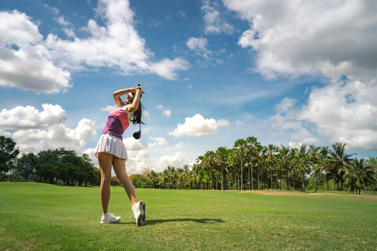 image of a woman golfer with the proper driving stance